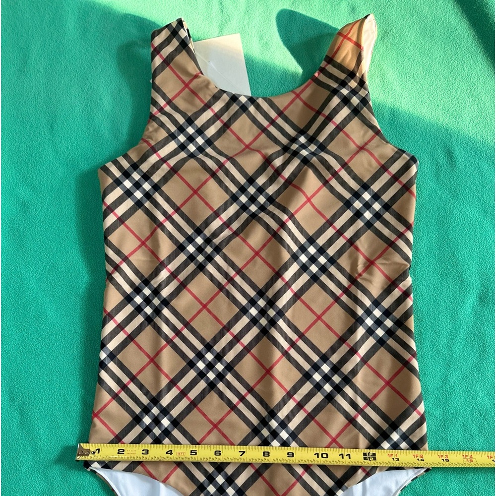 Burberry Check SwimsuitPrice $200
Archive Beige 14 years old .